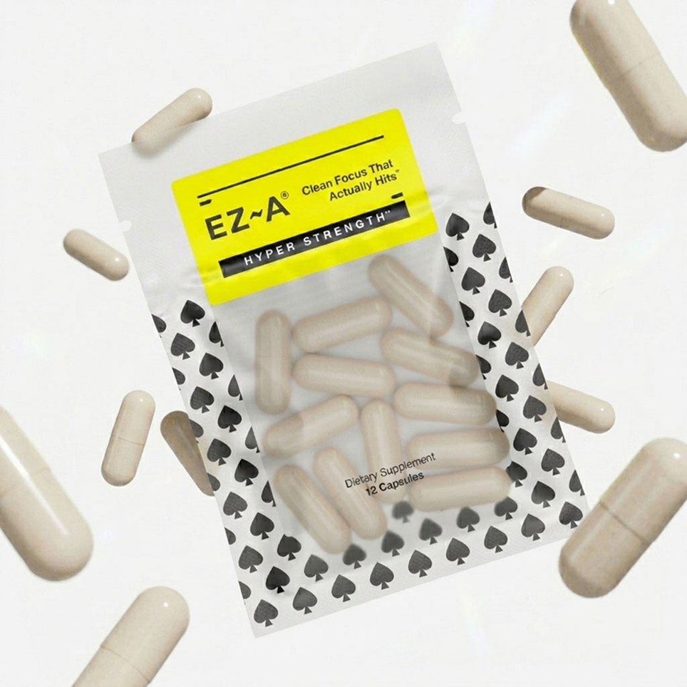 Packaging of EZ-A hyper strength dietary supplements with capsules scattered around on a white background.
